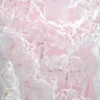Pink marble surface with white and cream veins, close-up texture central to a countertop or tile finish.